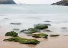 Ireland-Dunquin-Kinnard Beach Abstract of wave froth and rocks on shore Art Print